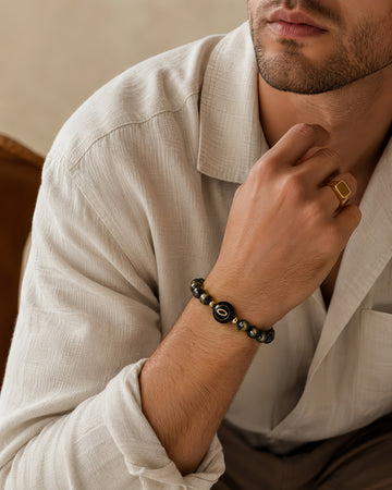 golden sheen obsidian NFC crystal bracelet, Amber Halo by Void Halo, worn on wrist
