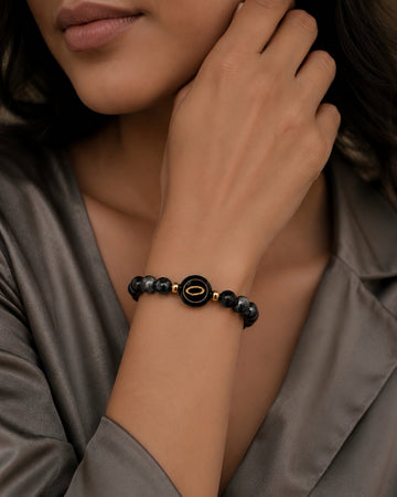 silver sheen obsidian NFC crystal bracelet, Chrome Halo by Void Halo, worn on wrist