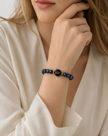 navy blue tiger's eye NFC crystal bracelet, Navy Halo by Void Halo, worn on wrist