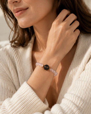 pink rose quartz NFC crystal bracelet, Rose Halo by Void Halo, worn on wrist