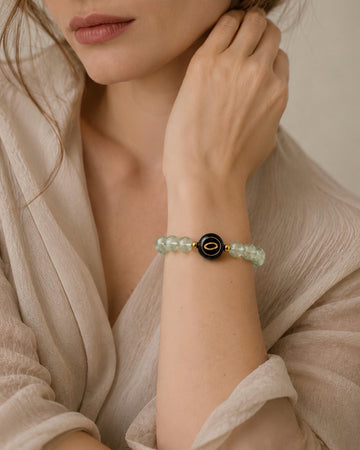 sage green prehnite NFC crystal bracelet, Sage Halo by Void Halo, worn on wrist