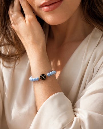 powder blue angelite NFC crystal bracelet, Sky Halo by Void Halo, worn on wrist